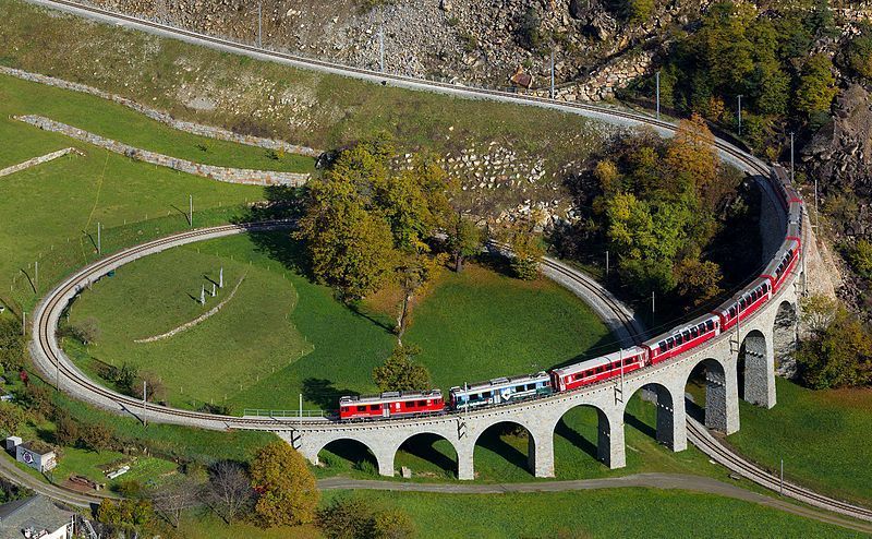  Two Rhaetian Railways ABe 4/4 III multiple units with a local train from St. Moritz to Tirano are just crossing the Brusio spiral viaduct. Picture taken near Brusio, Switzerland, fot. Kabelleger / David Gubler